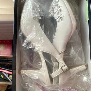 White heels with floral details